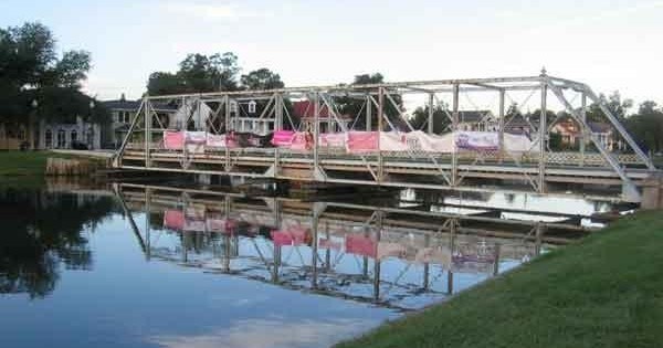Historic iron truss bridge spanning Bayou St. John on a New Orleans cultural kayak tour